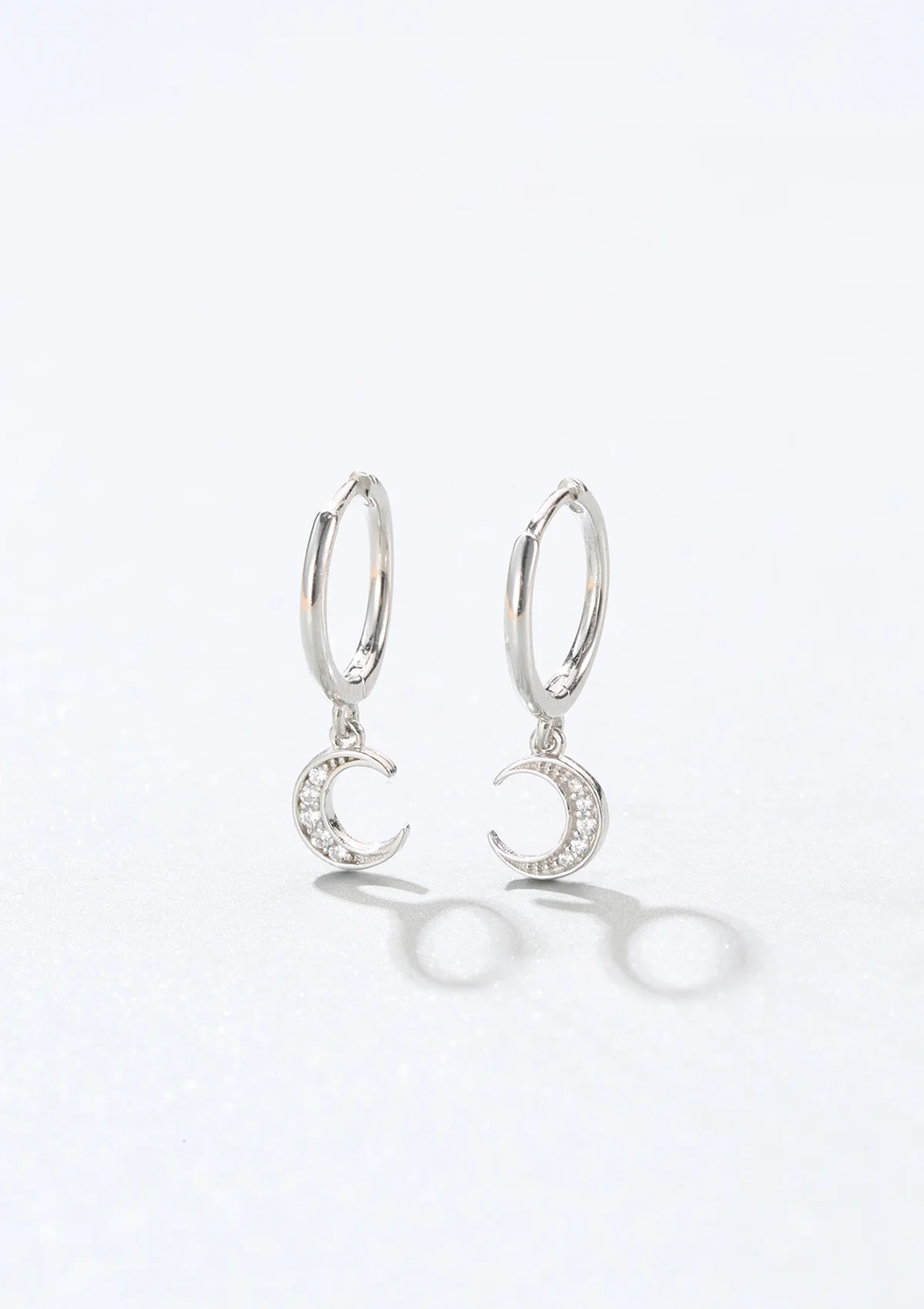 Crescent Moon Huggie Earrings Sterling Silver - Image 3